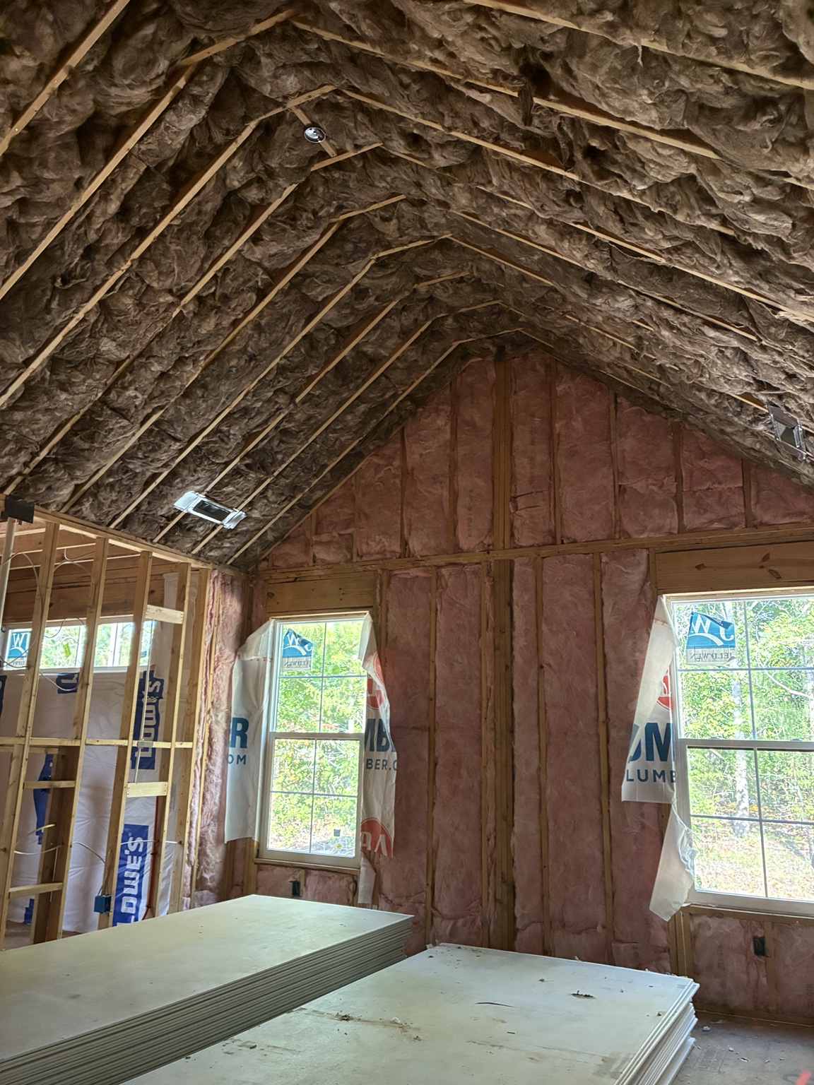 Fiberglass batts installed in a vaulted ceiling and exterior walls