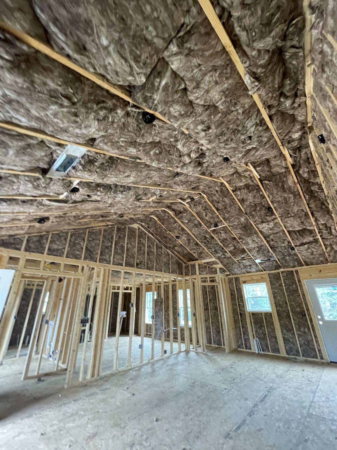 Batt insulation installed in the walls and cathedral ceiling of a new construction home