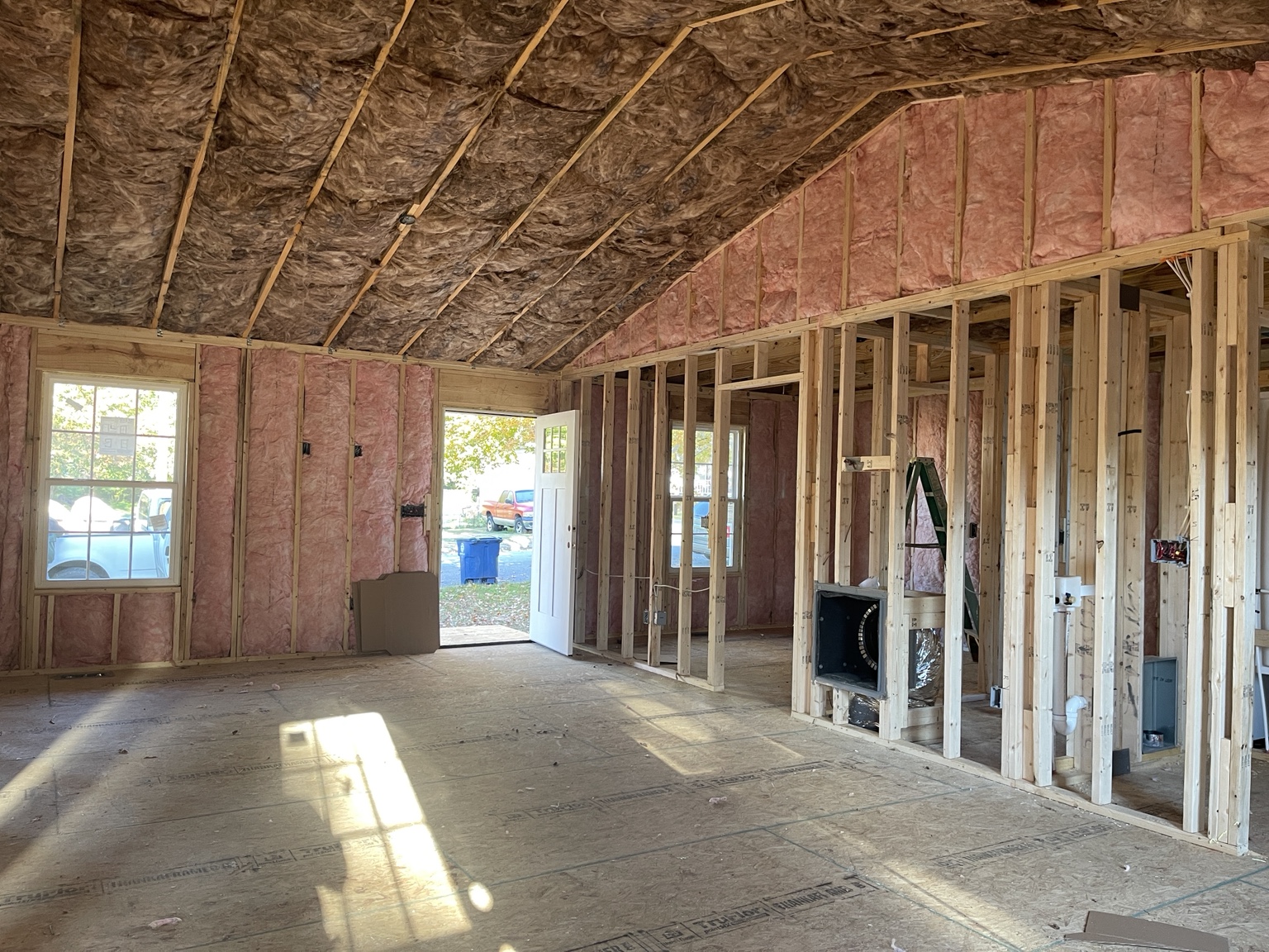 Completed batt insulation throughout the walls and vaulted ceiling of a new home